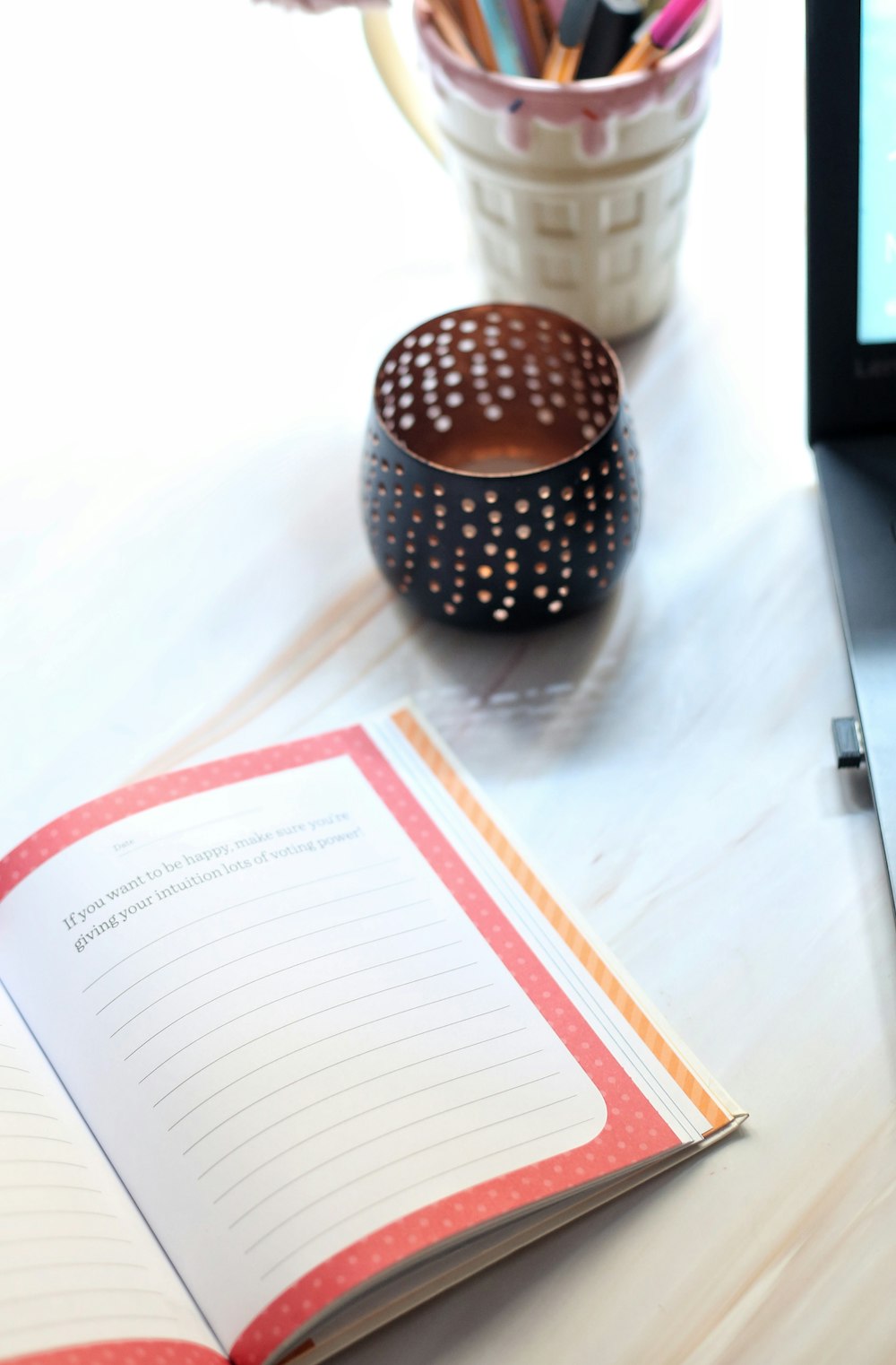 a book and a pencil on a table