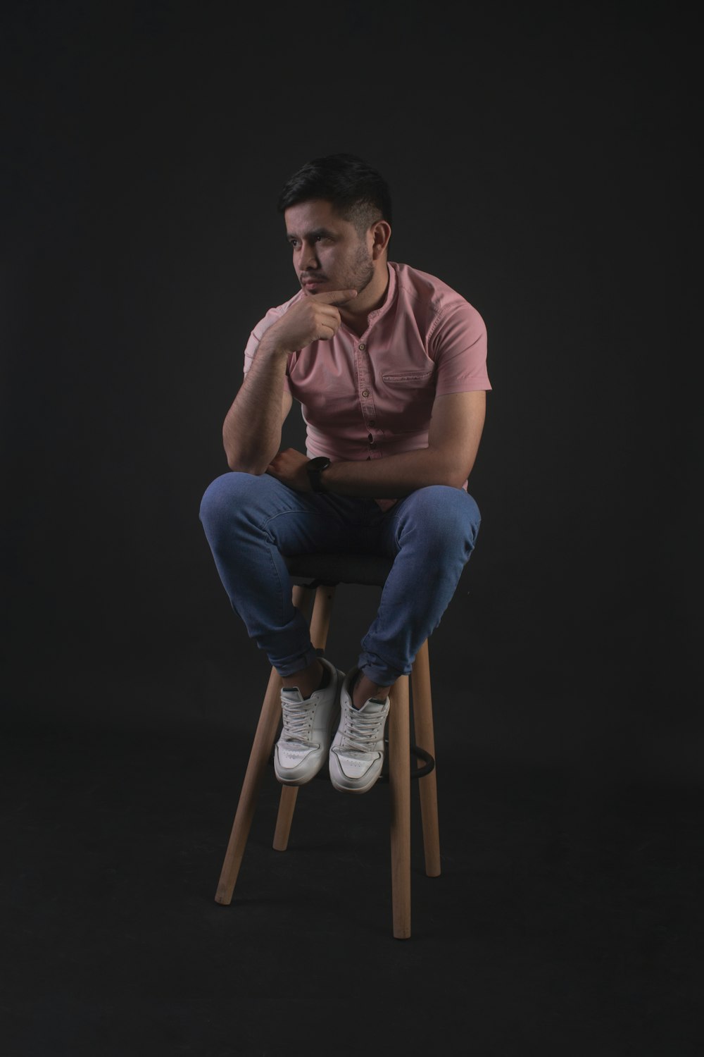 a man sitting on a stool