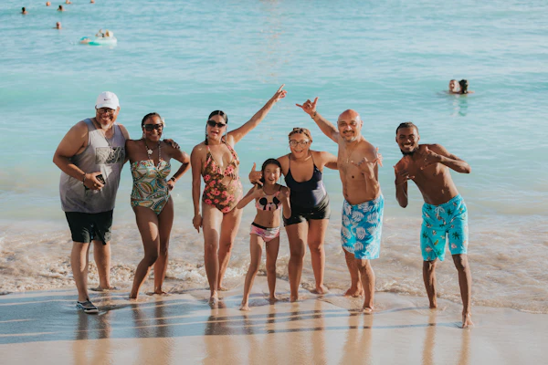Group of travelers posing together on a beach in Zanzibar