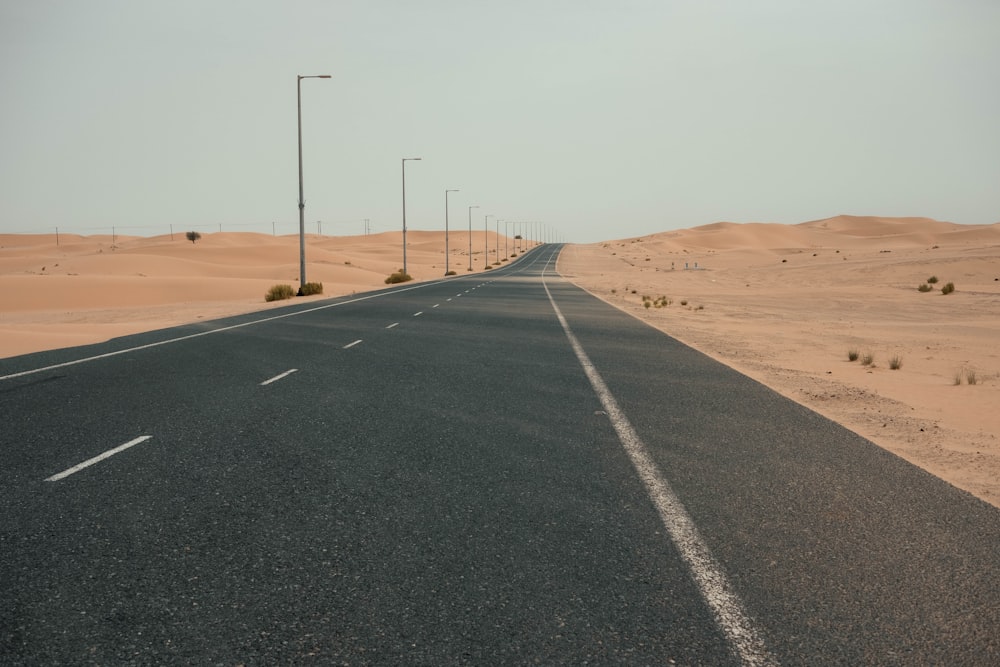 a road with a desert landscape