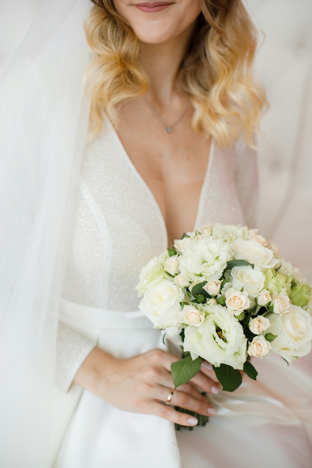 a woman holding a bouquet of flowers