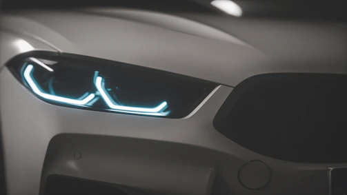 A modern car front view highlighting the sharp design of aitopone's LED daytime running lights.