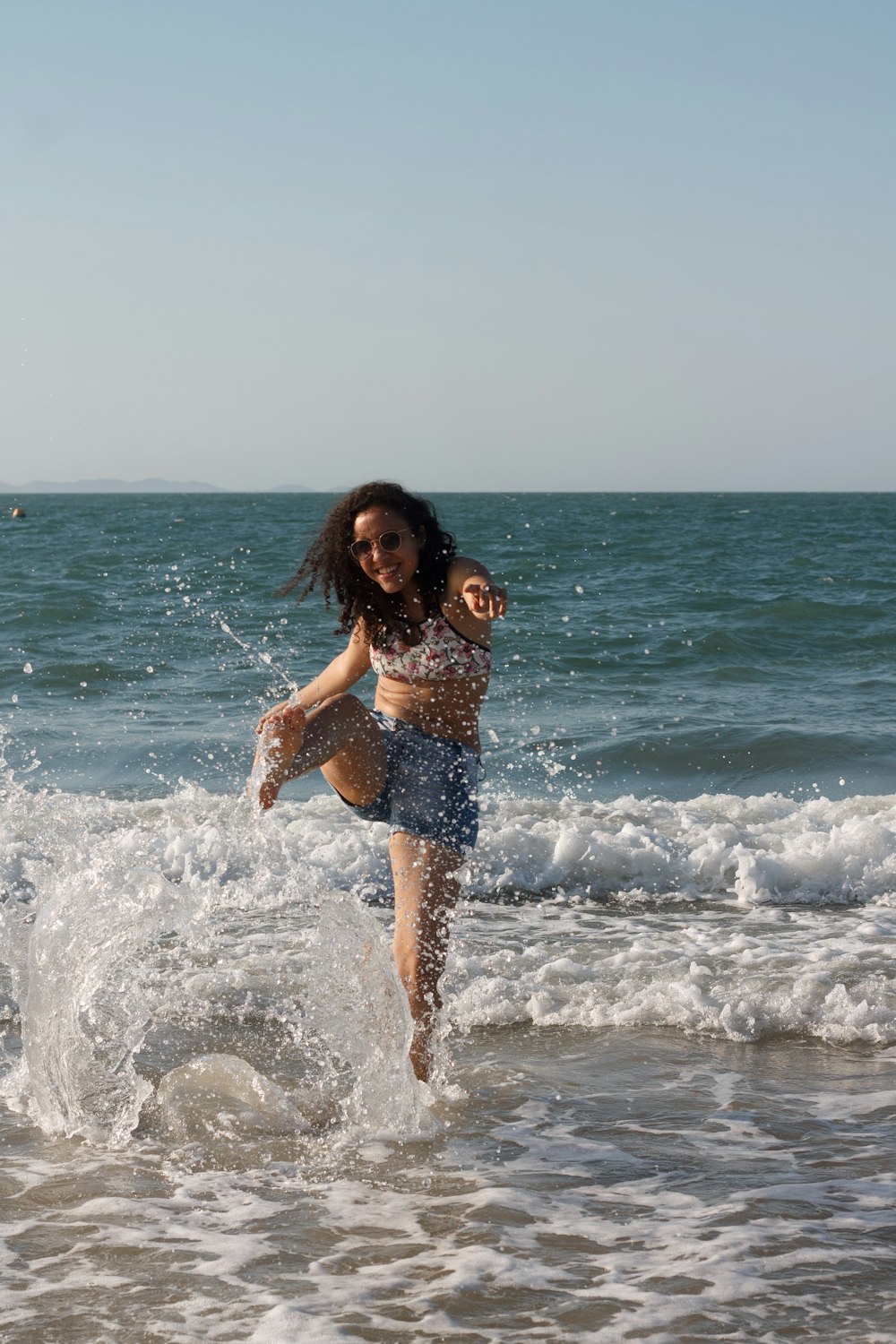 a person holding a child in the ocean