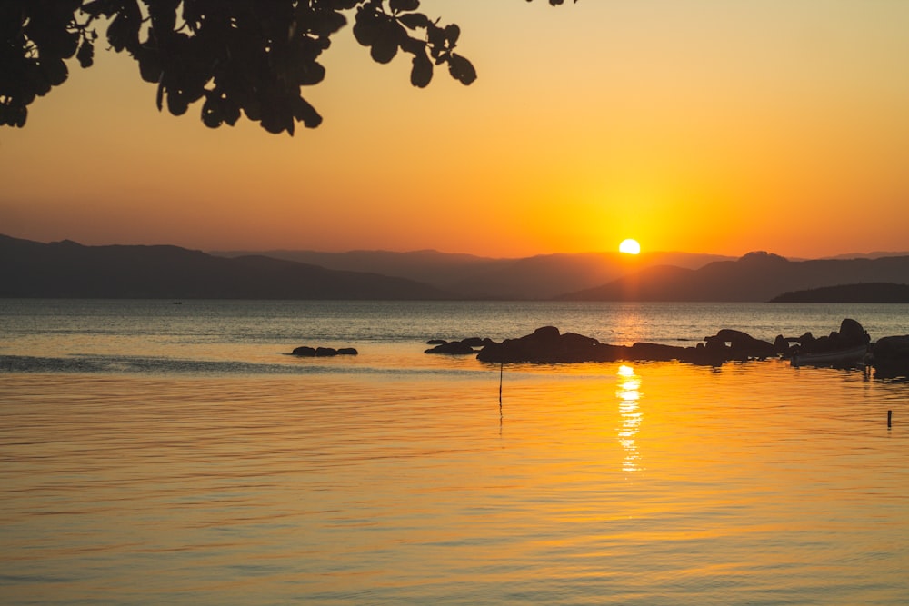 a sunset over a body of water