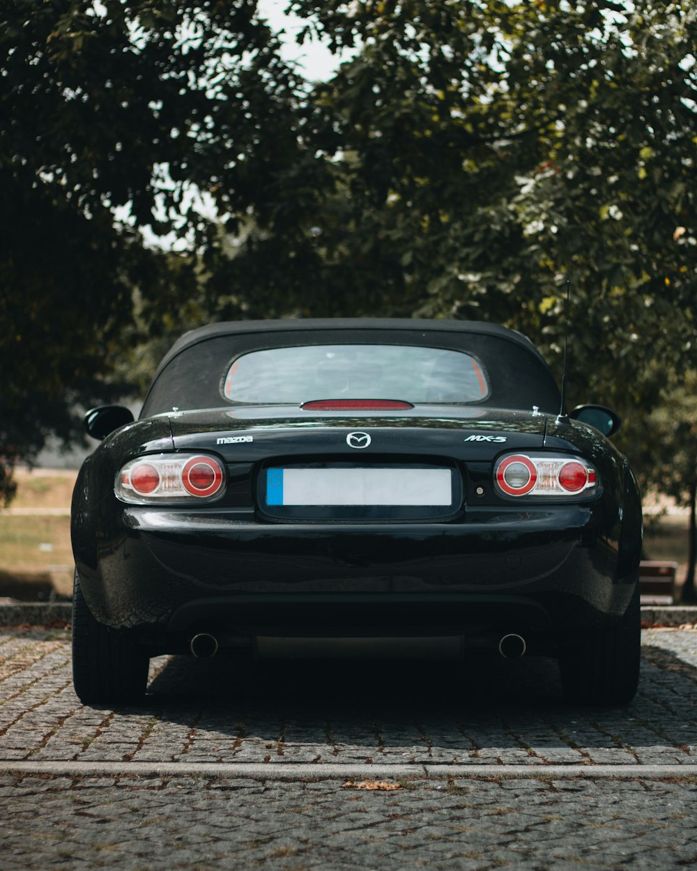 a black car parked on a road