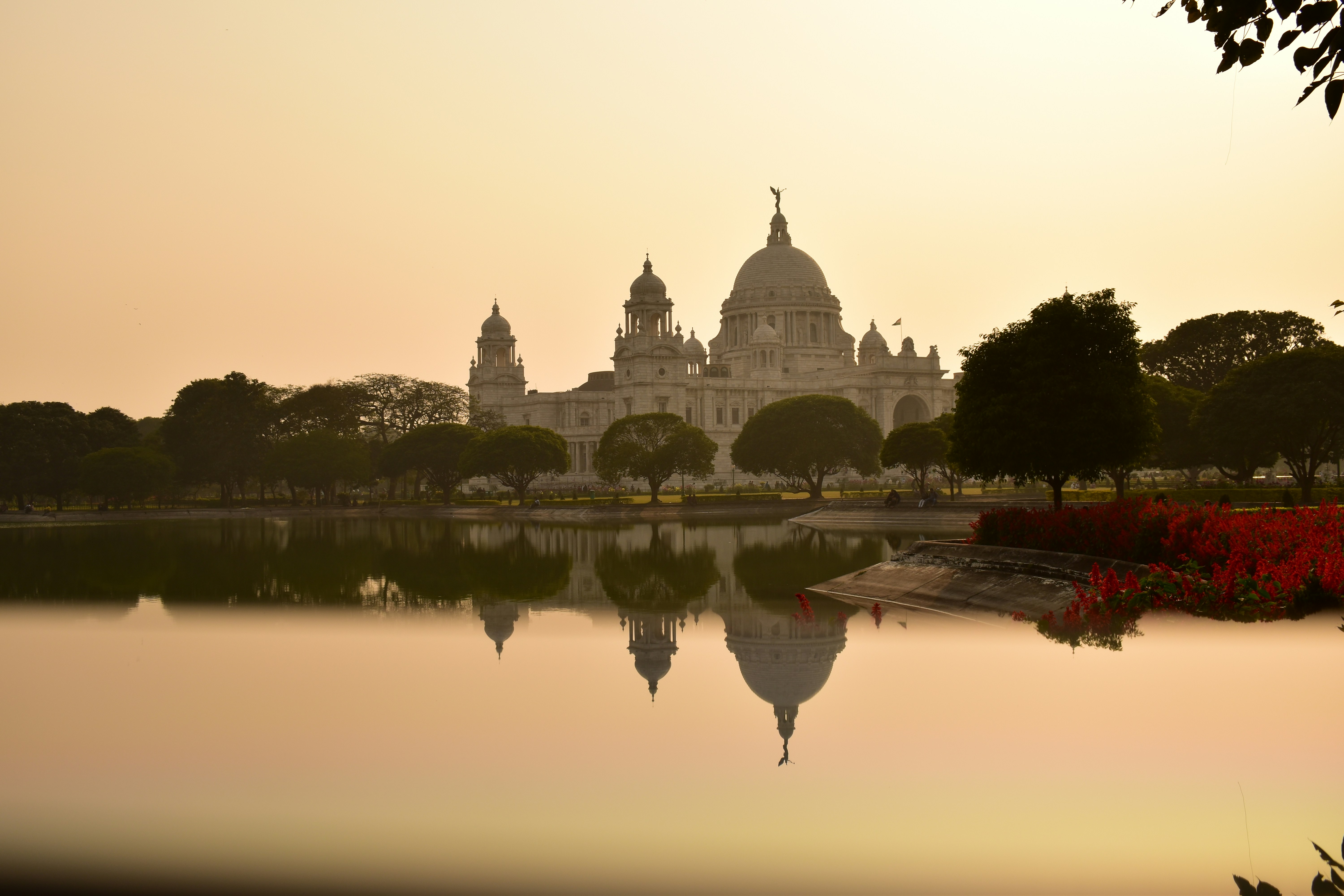 a body of water with a building in the background