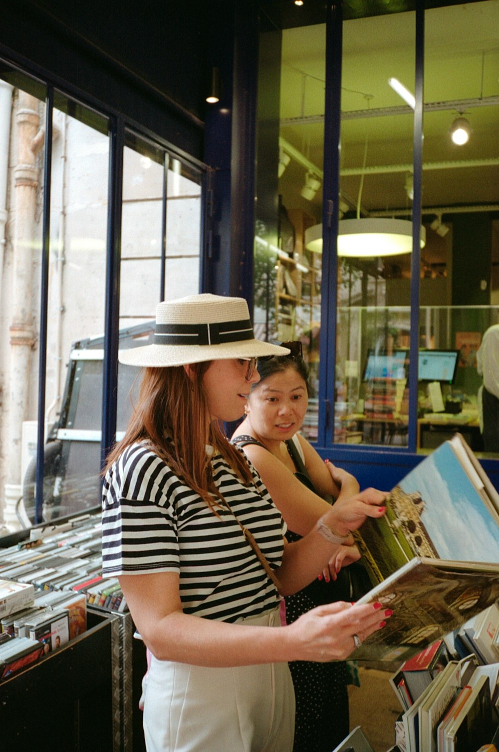 a woman holding a box and a woman holding a box