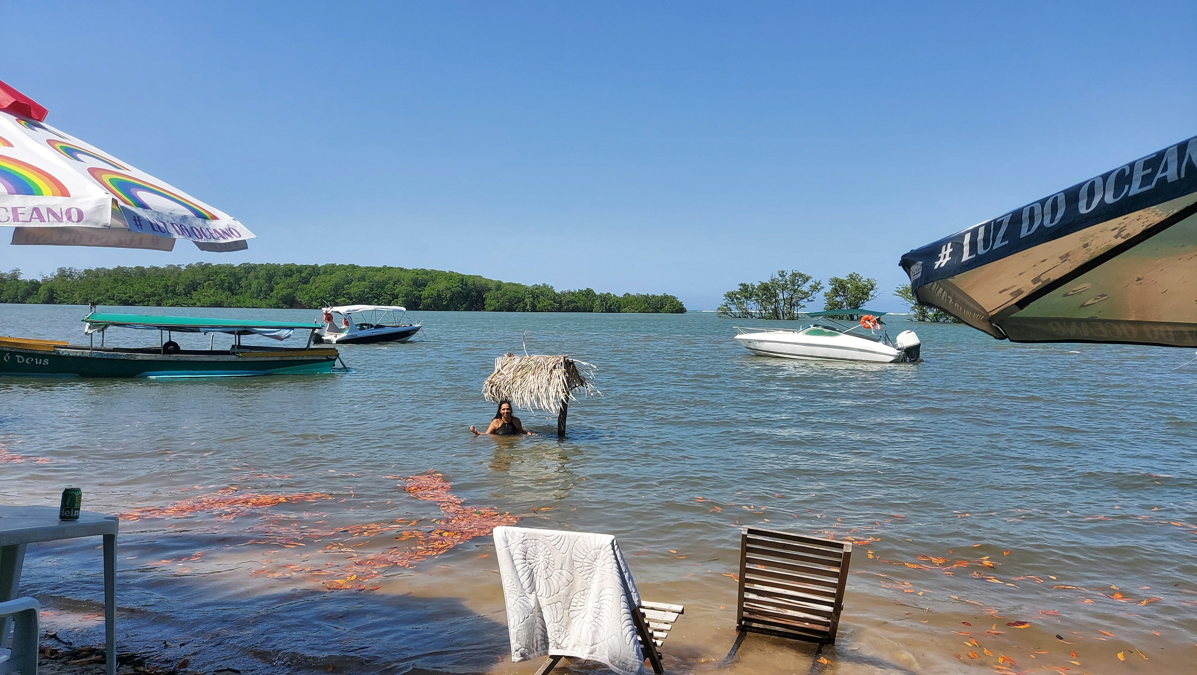 a body of water with boats and a person in it