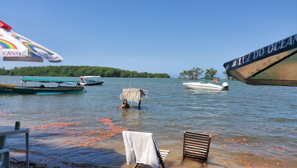 a body of water with boats and a person in it