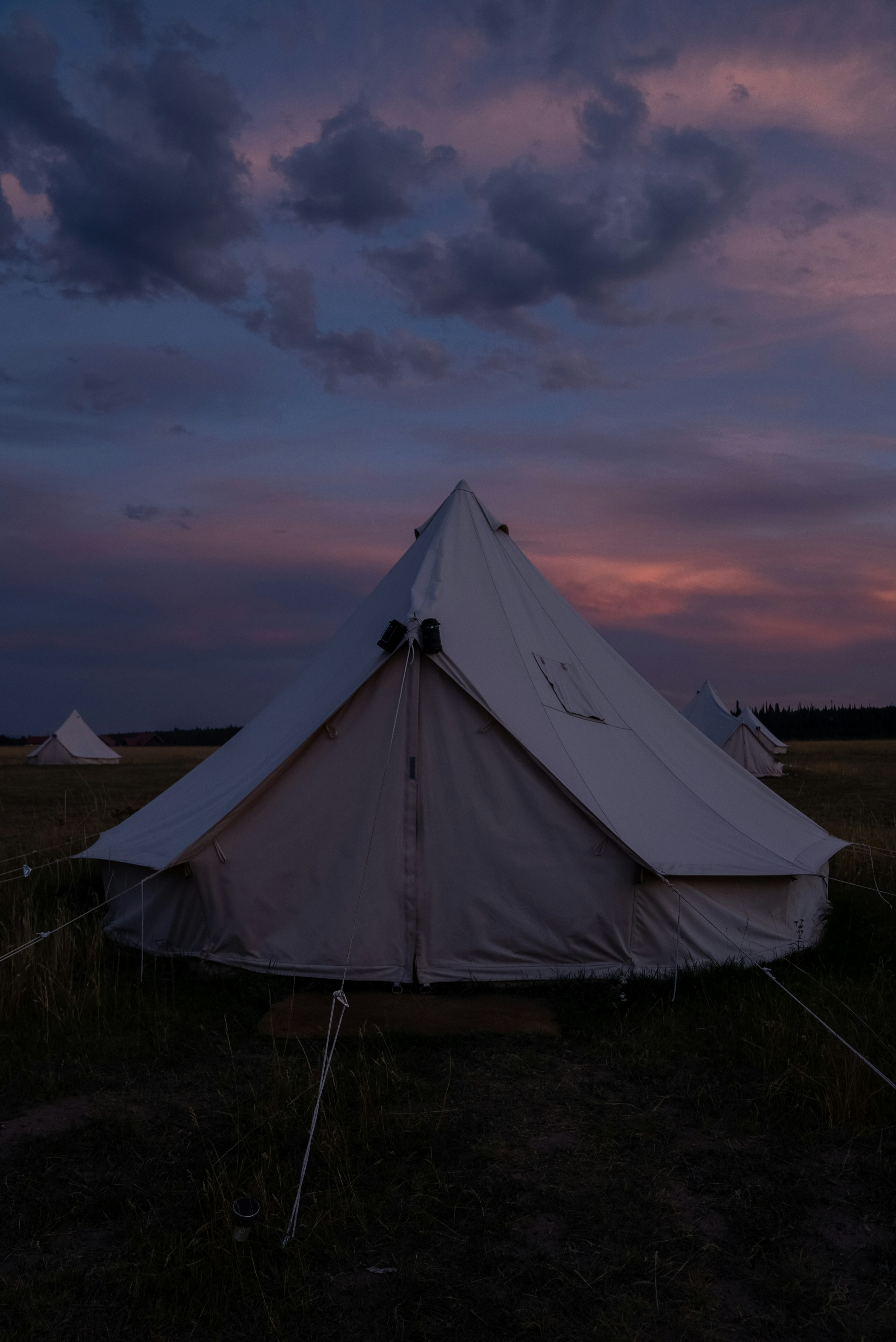 a white tent in a field