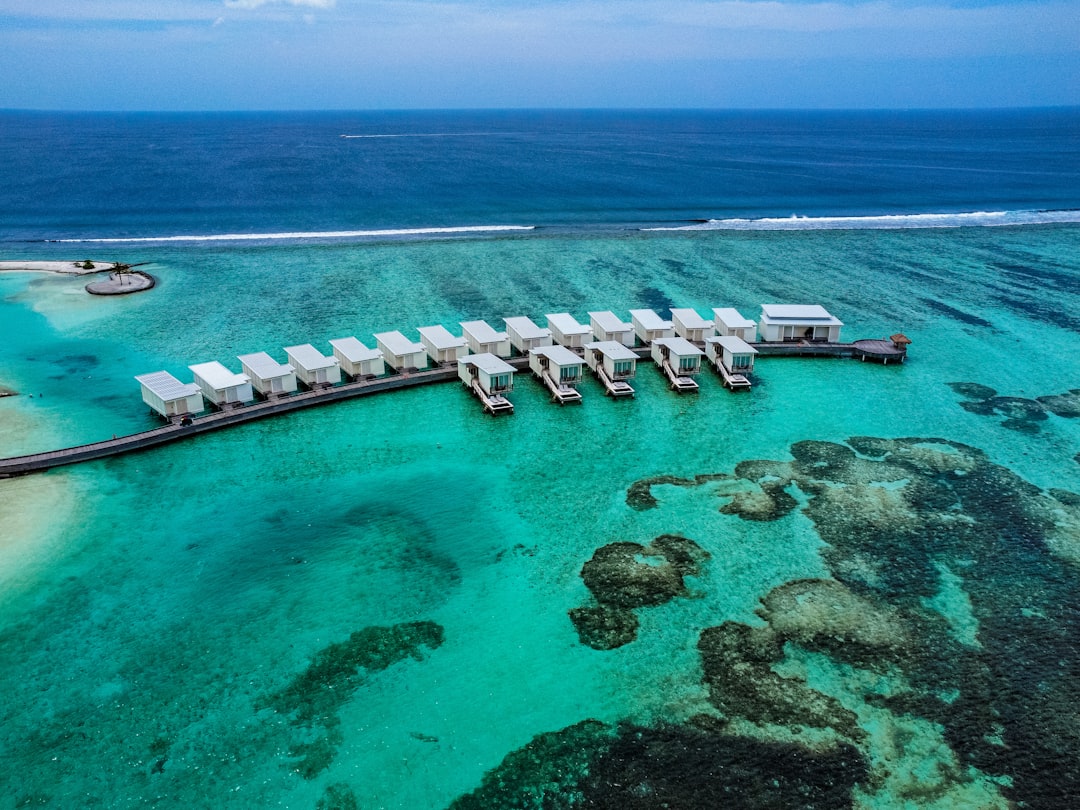 a body of water next to the ocean, Aerial view of Kandoomaa Holiday Inn Resort