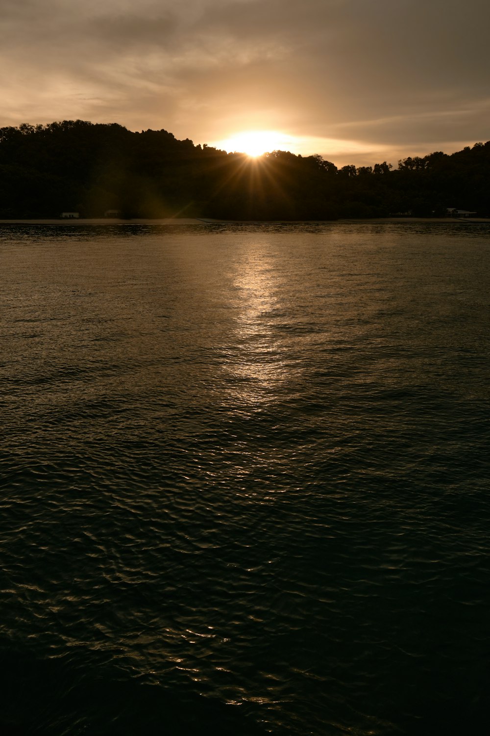 a sunset over a body of water