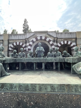 a group of statues in front of a building