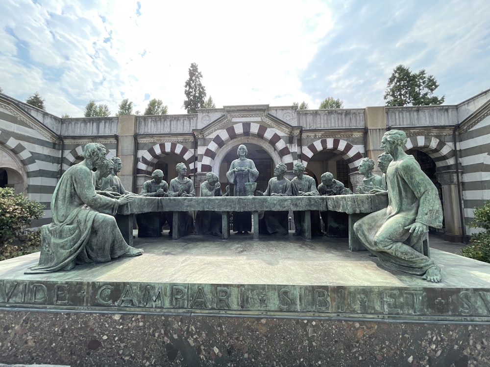 a group of statues in front of a building