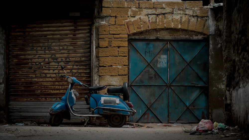 a scooter parked outside a building