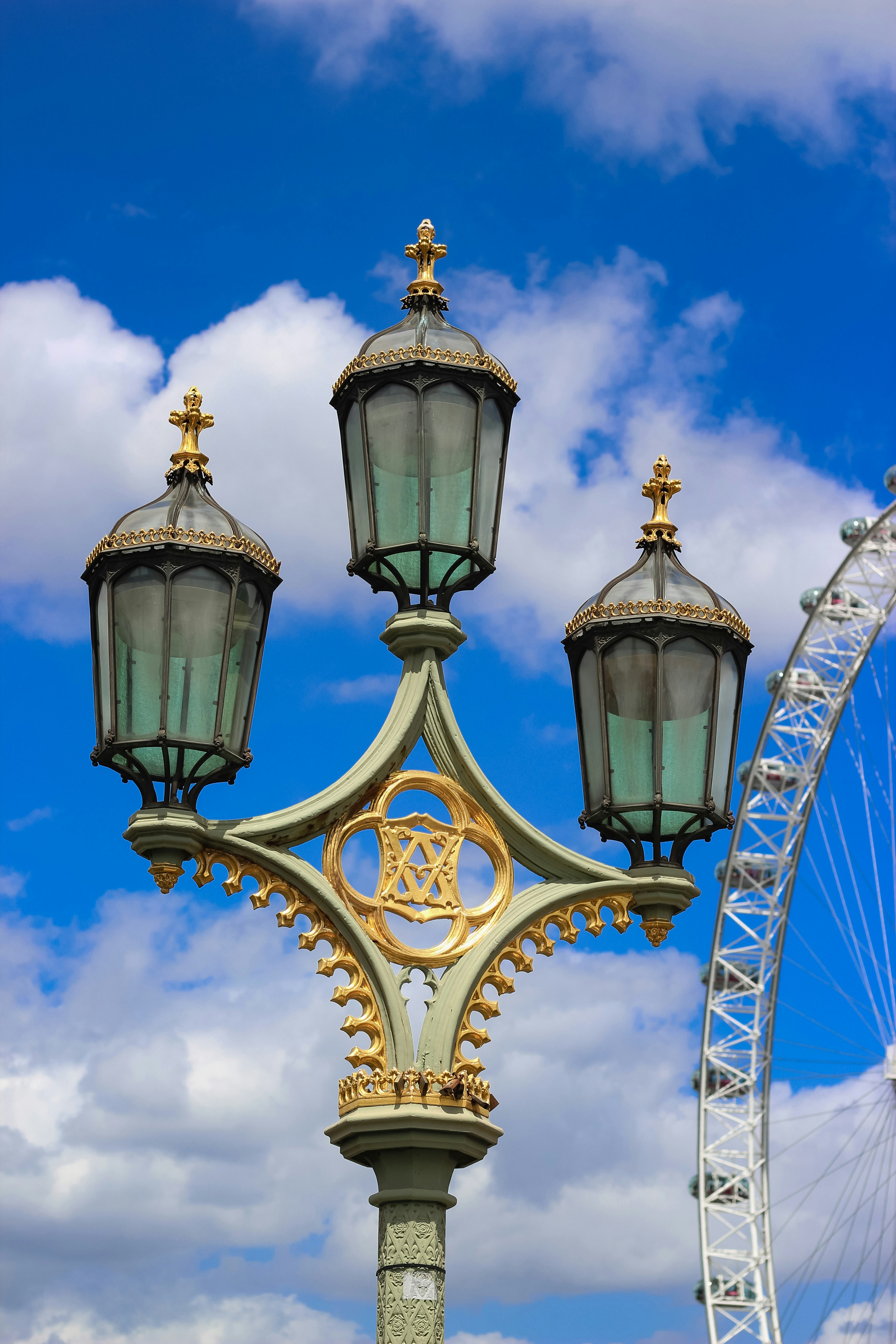 A group of street lamps photo Free London eye Image on Unsplash