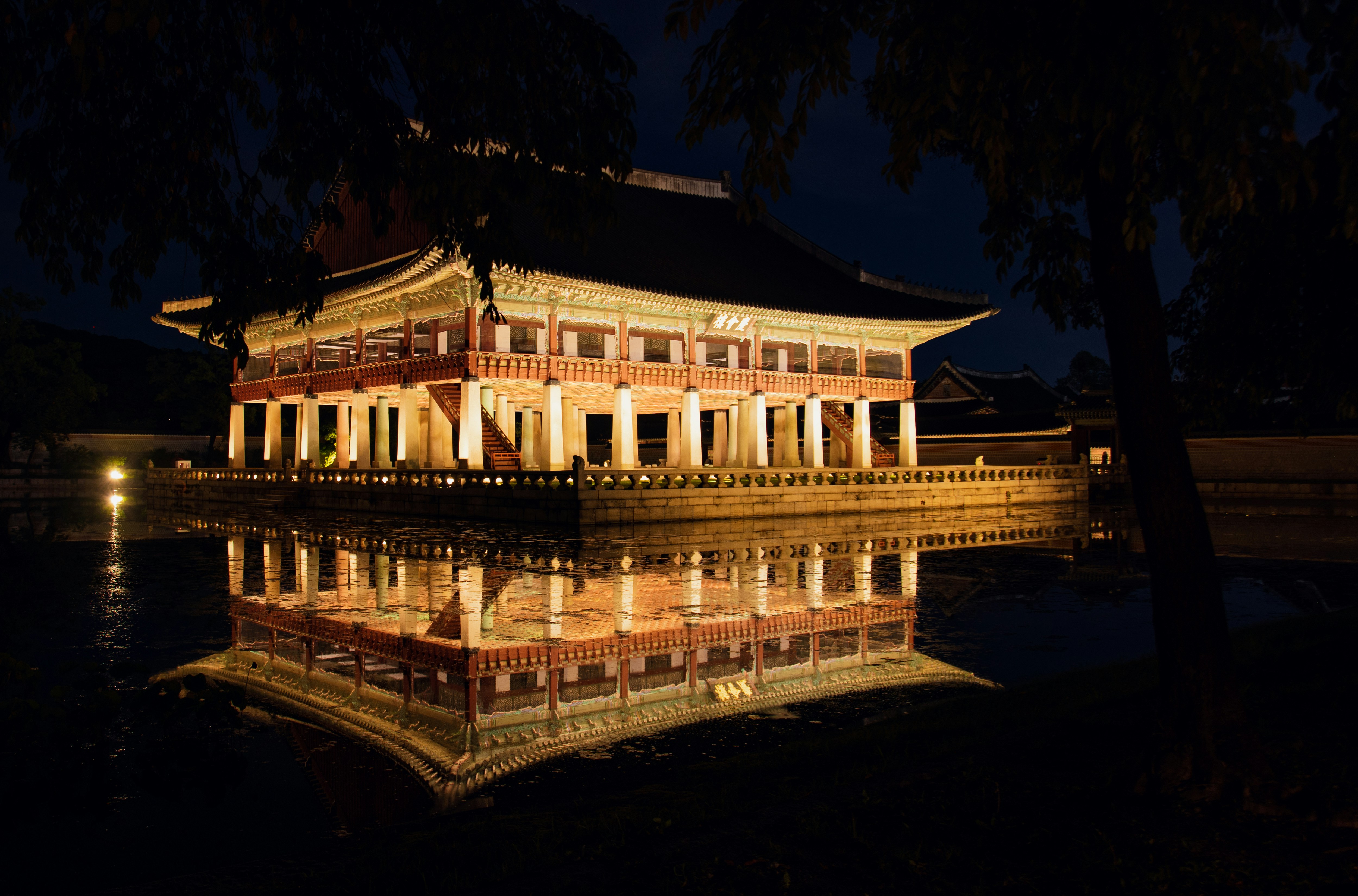 a building with columns at night