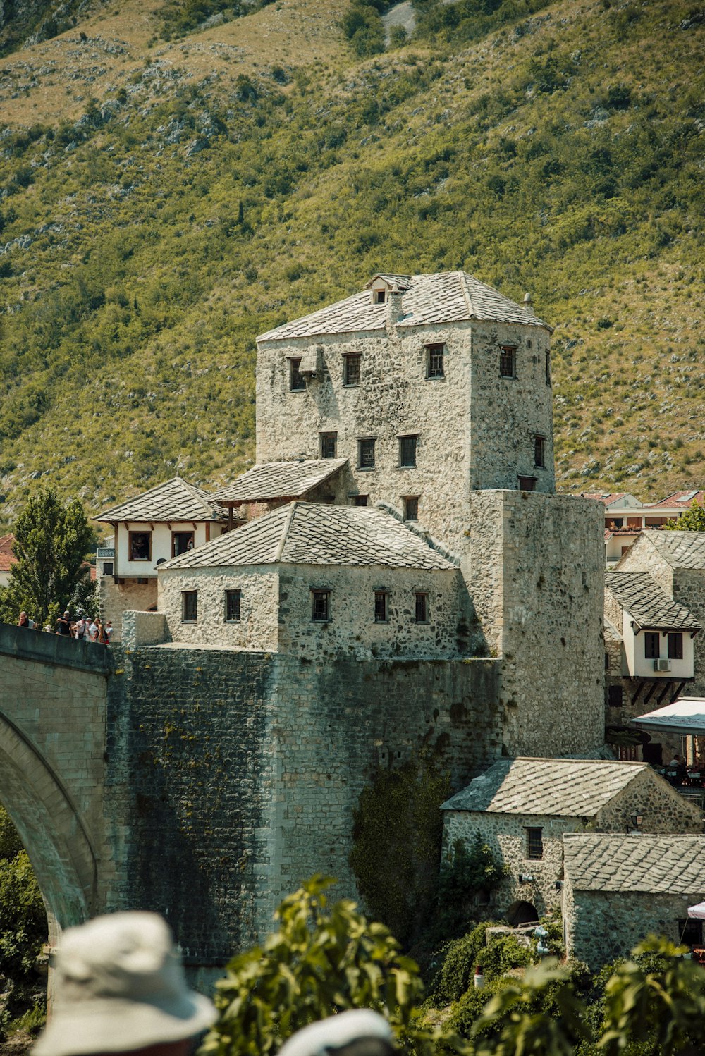 a stone castle with a bridge