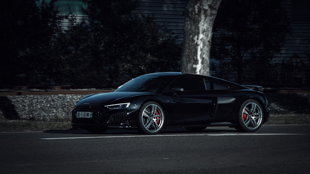 a black car parked on a road