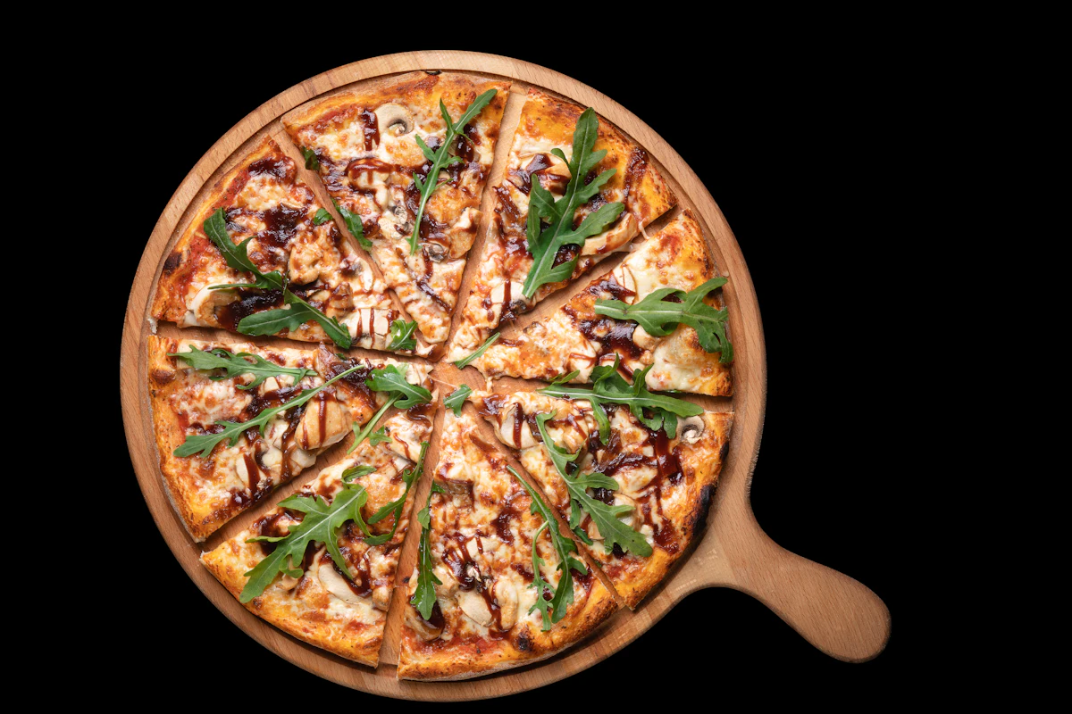 Vegetable pizza loaded with roasted peppers, onion and herbs