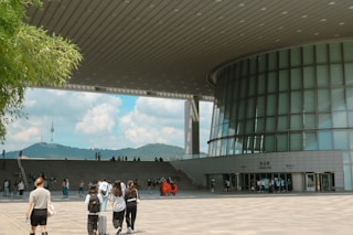 people walking in a large building