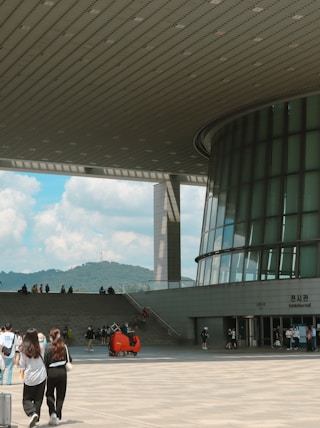 people walking in a large building