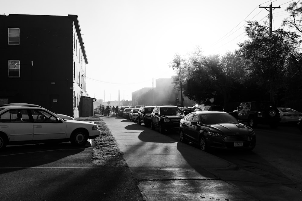 a row of cars parked on the side of a road