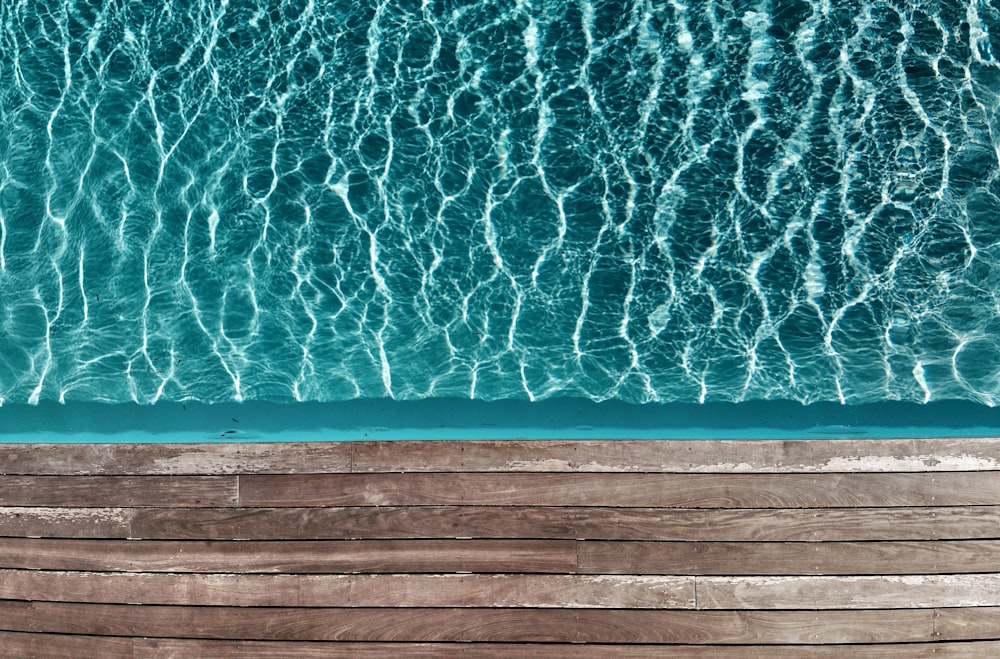 a group of people swimming in the ocean