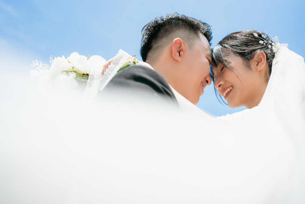 a man and woman holding flowers