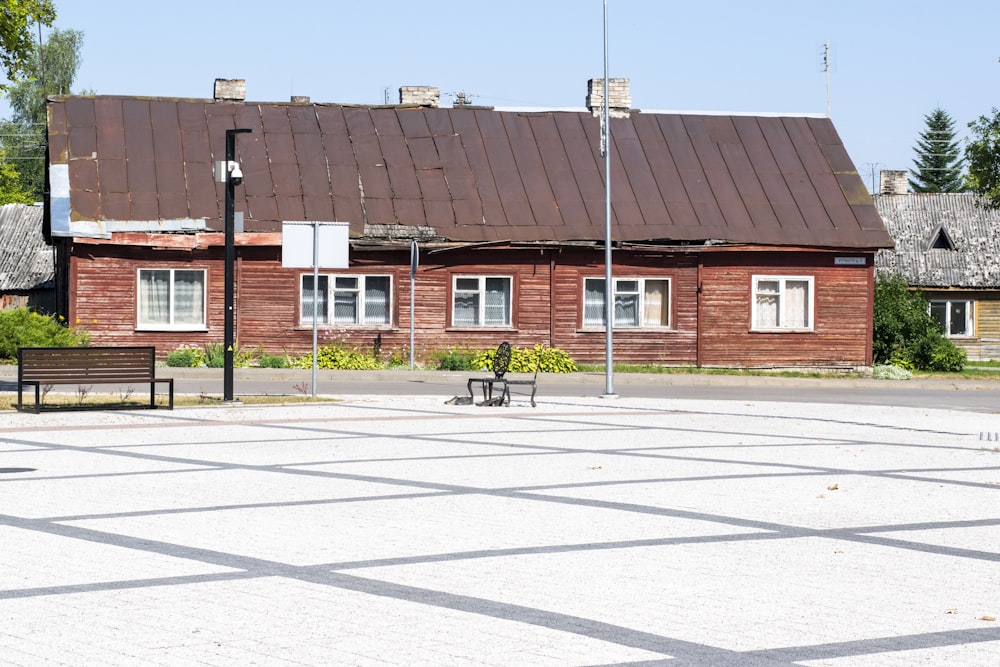 a brick building with a bench in front of it