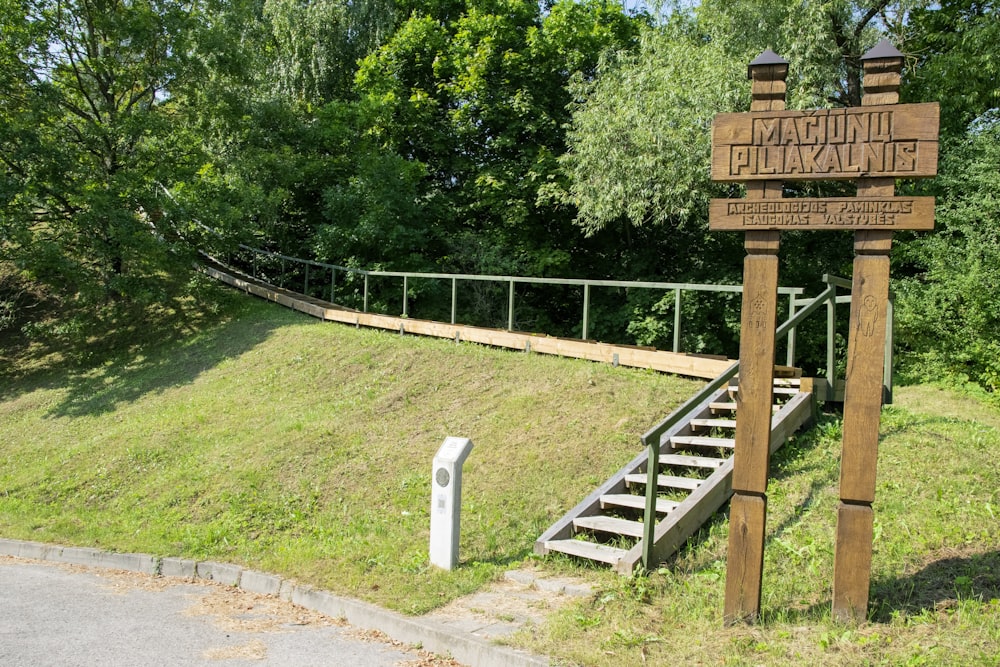 a sign on a wooden post