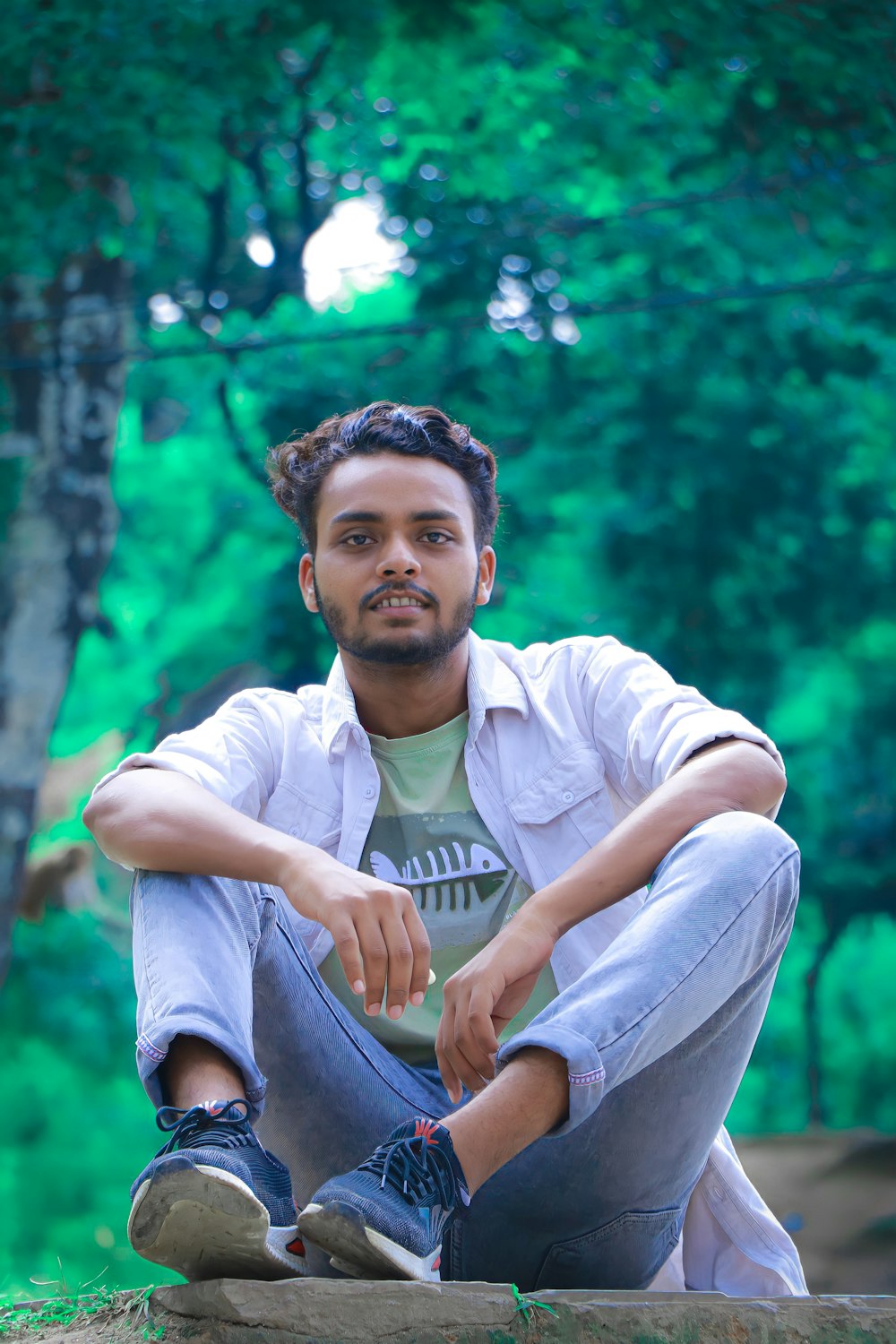 a man sitting on a rock