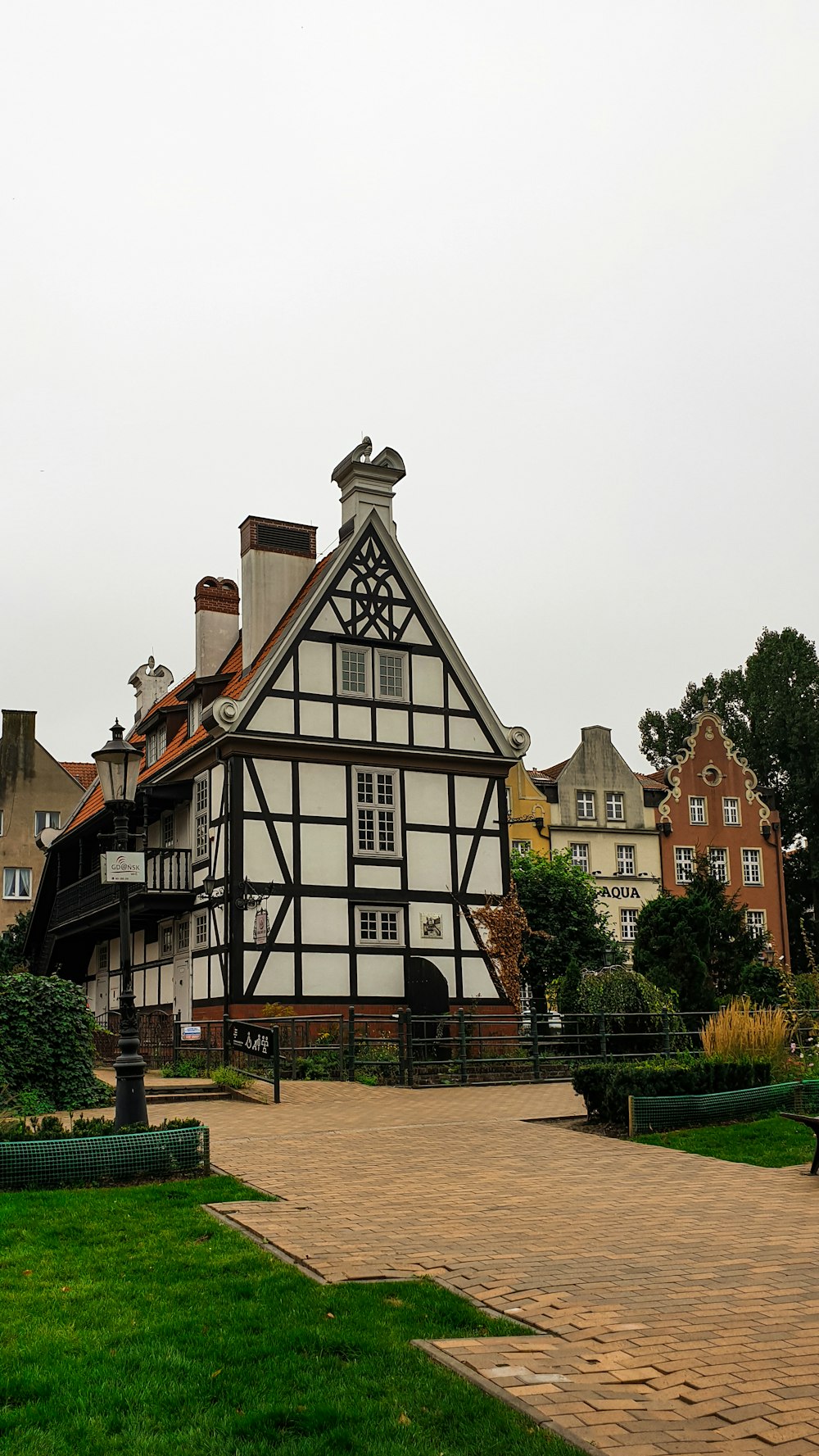 a large house with a brick walkway