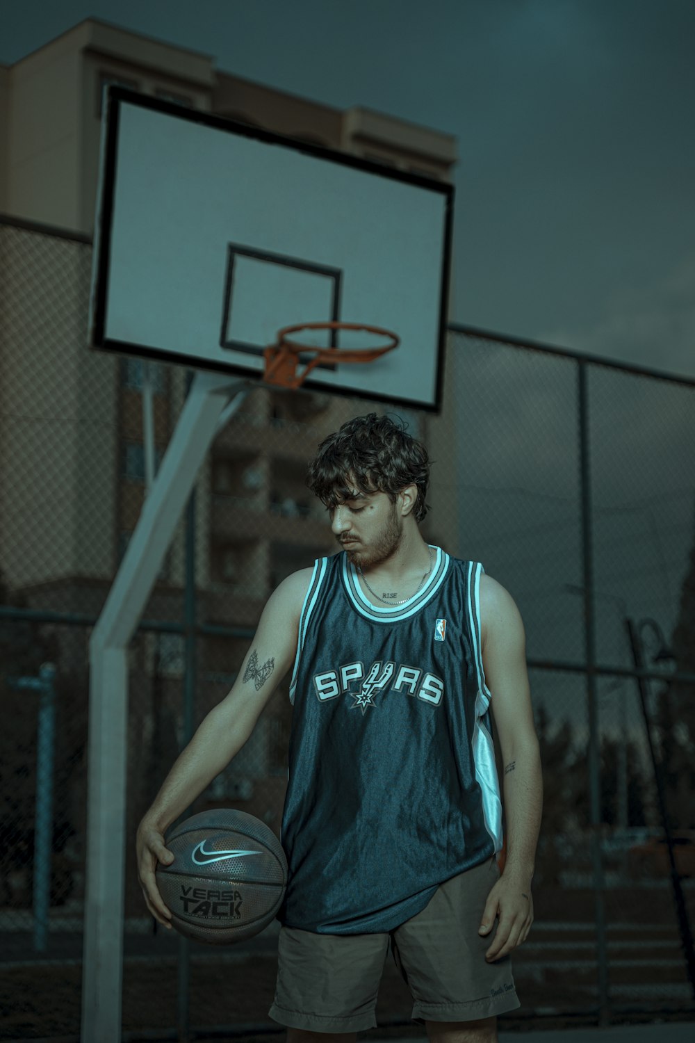 a man holding a basketball