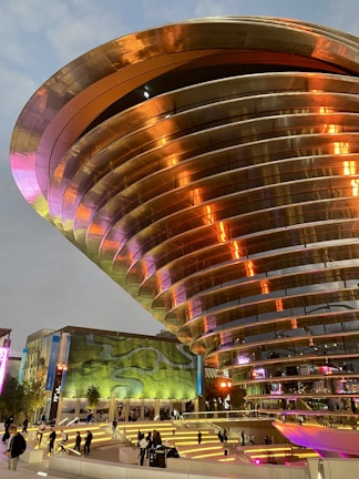 Modern community event at Pabellón Zeri with neon accents and clean eco-modern design elements.