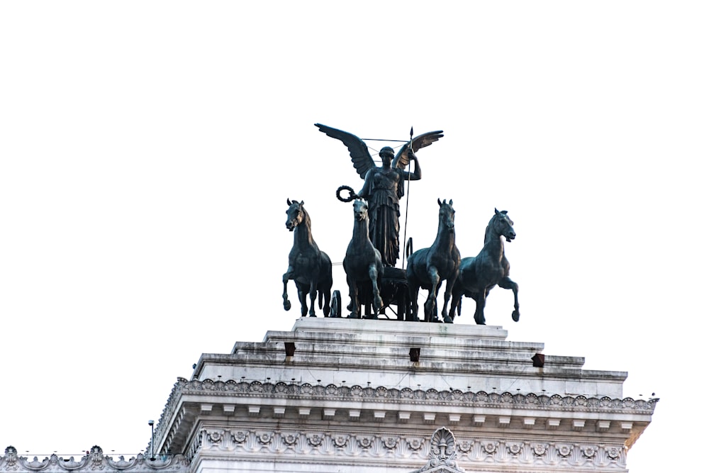 a statue of a group of men riding horses