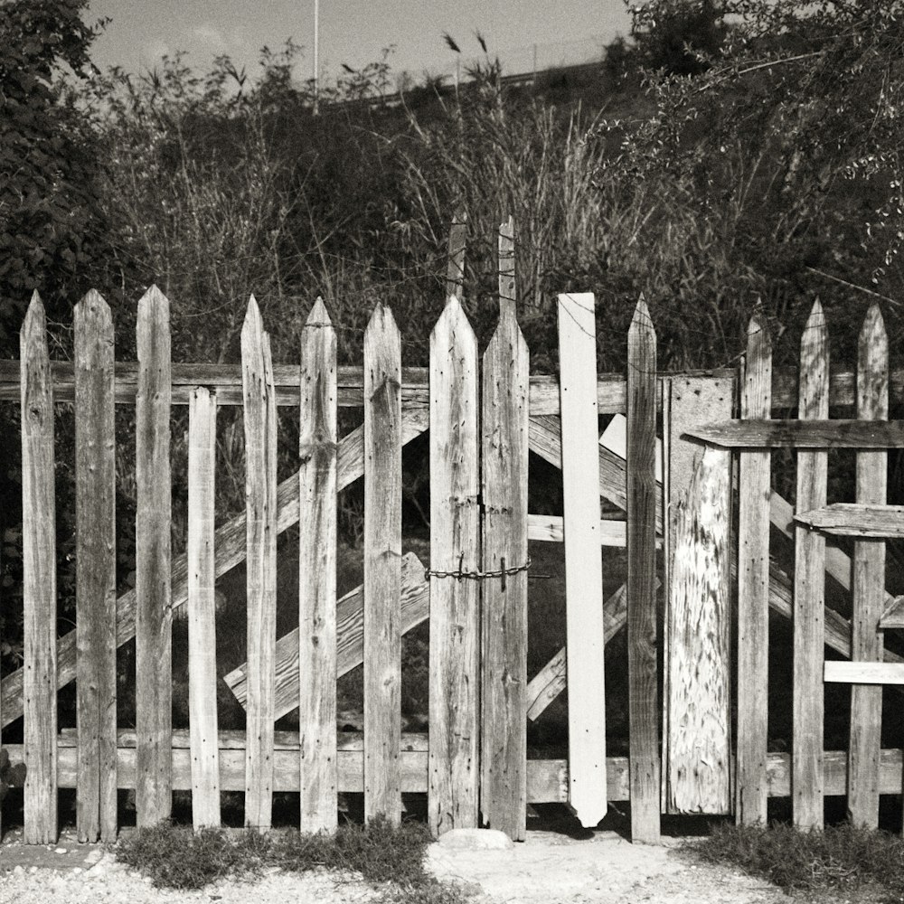 a wooden fence with a wooden gate