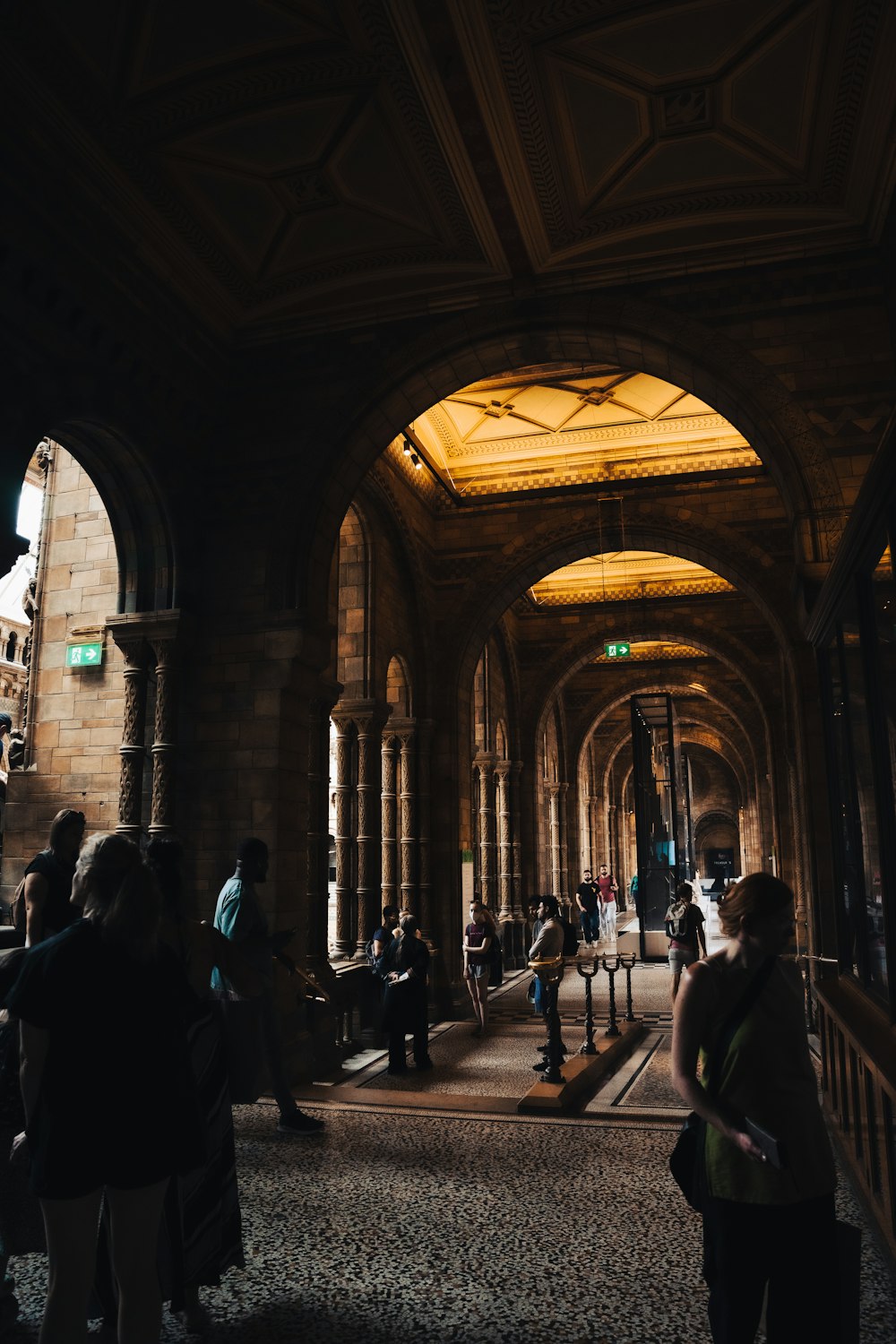 a group of people walking through a building