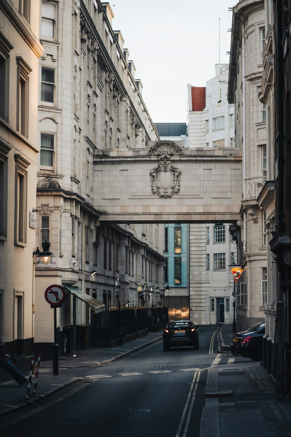 a street with cars and buildings on either side of it