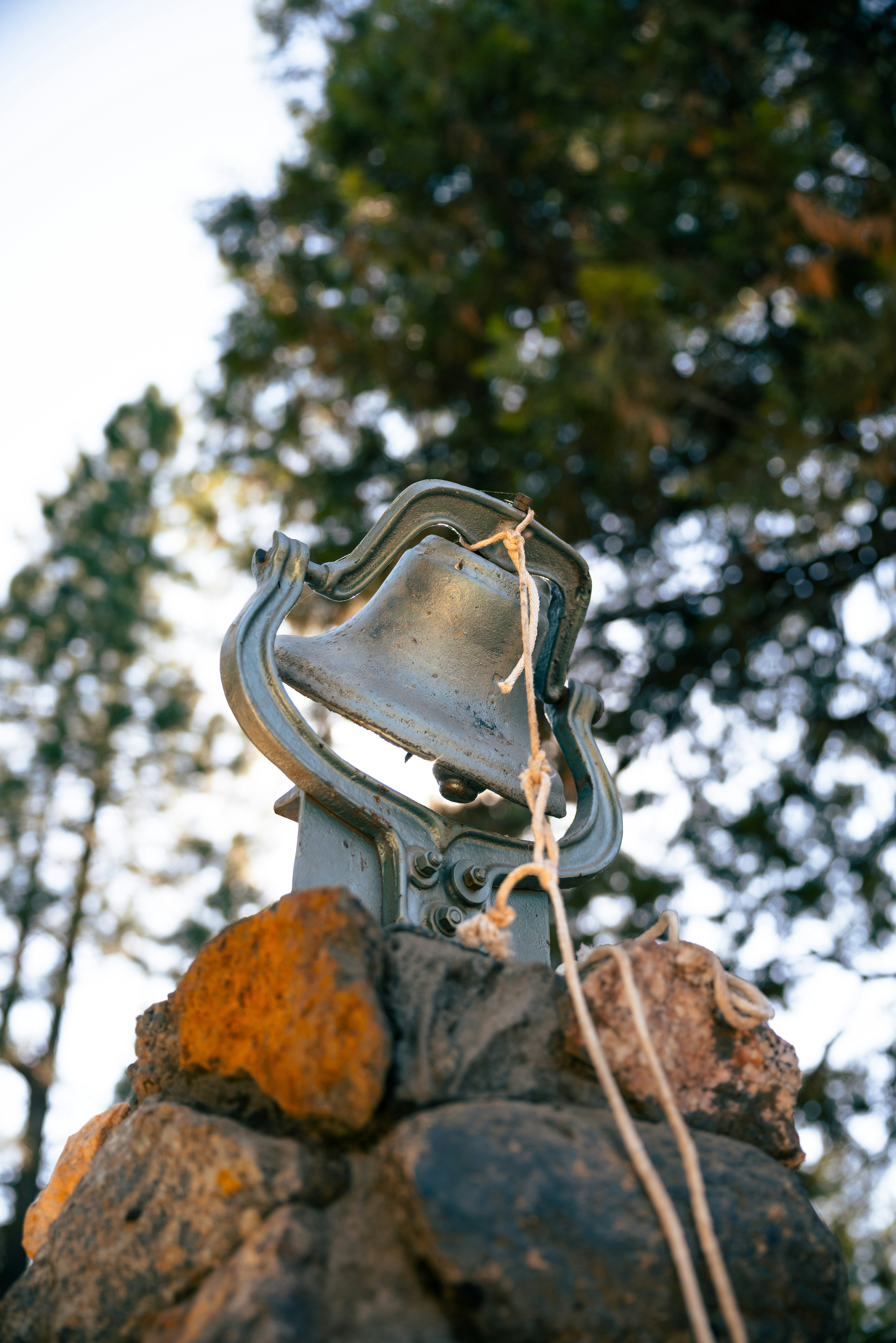 Modern Metal Bell in the Forest
