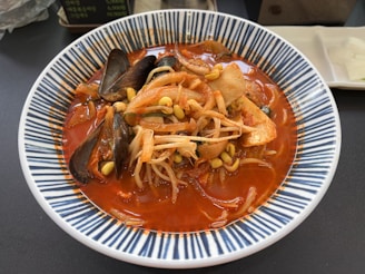 A steaming bowl of freshly made seafood noodle soup served at a local eatery.