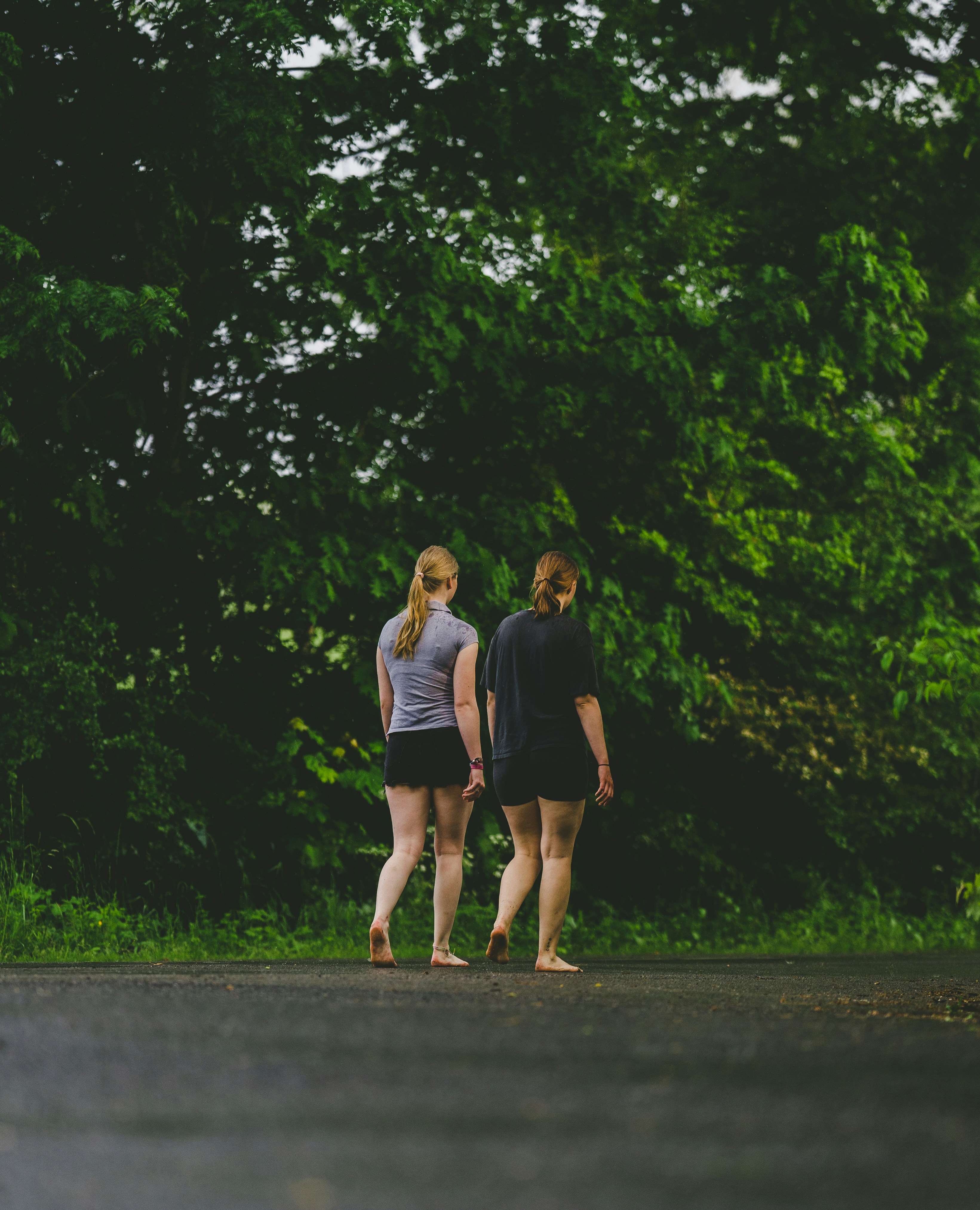 Two women walking on a path photo – Free Woman Image on Unsplash