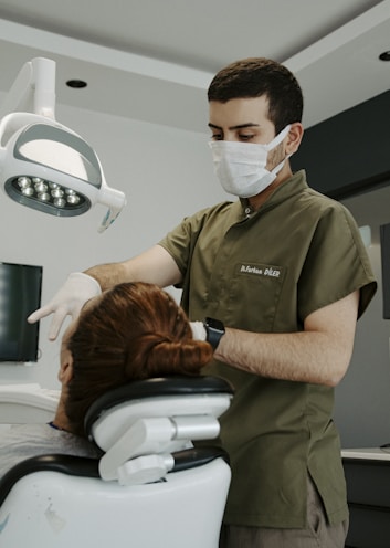 a man in a mask and a woman in a hospital bed