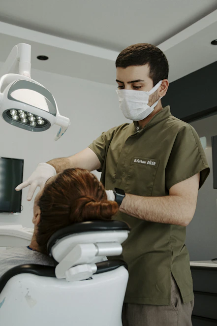 a man in a mask and a woman in a hospital bed