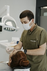 a dentist examining a patient