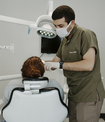 a dentist examining a patient