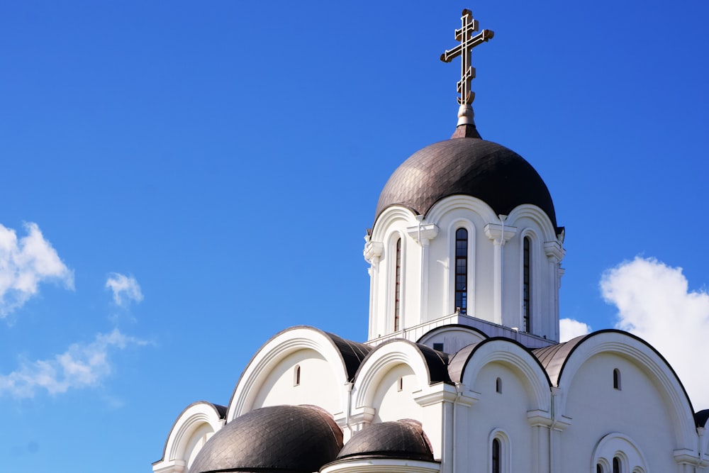 a white building with a cross on top