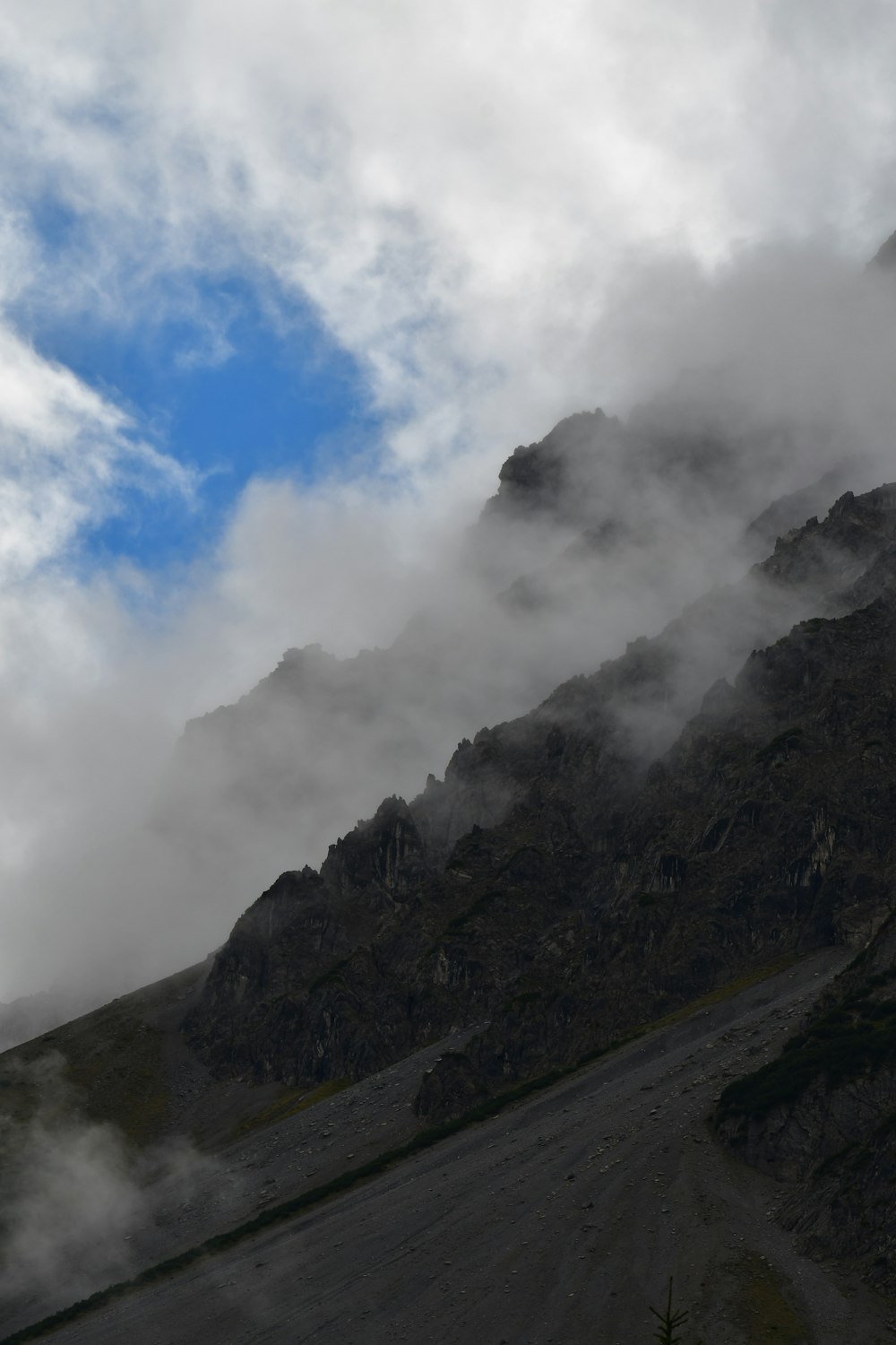 a mountain with clouds