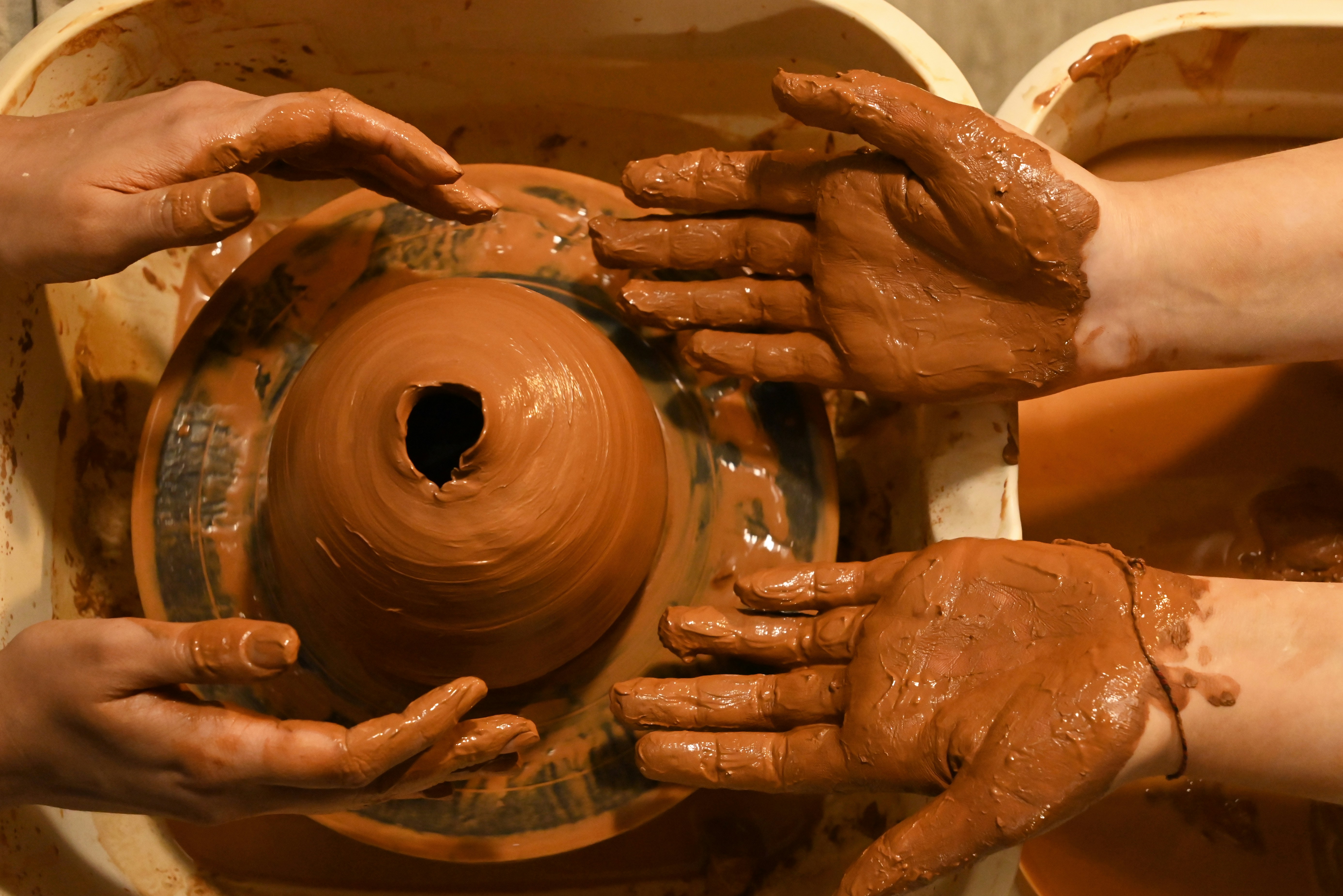 a close-up of hands holding a wheel