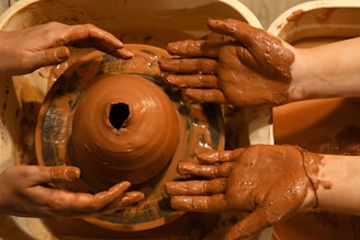 a close-up of hands holding a wheel